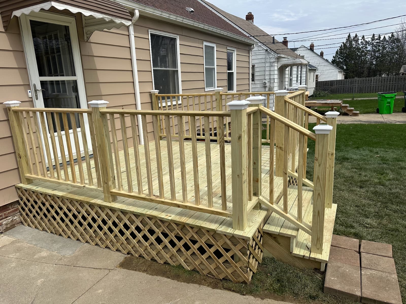 New wood deck with railings and lattice skirting