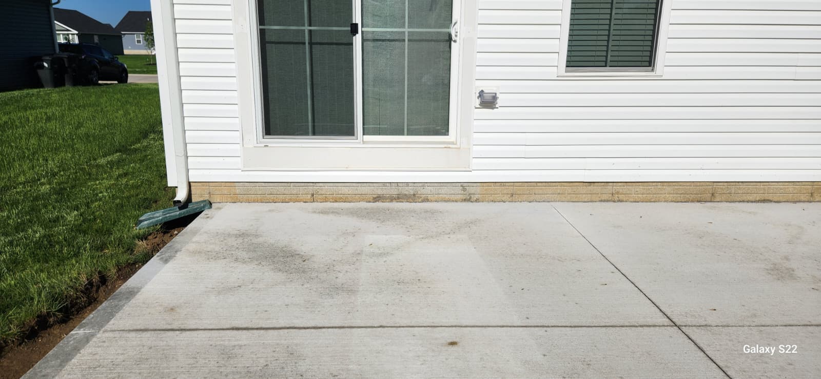 Clean concrete patio area prepared for exterior access work